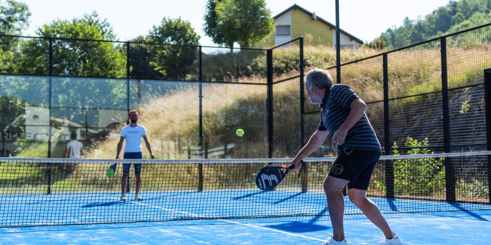 Holidaymakers playing on the multisport pitch