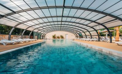 Indoor water park with heated pool and swimming areas